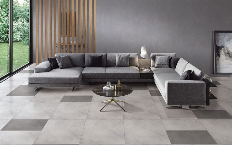 Bạn có thể tạo điểm nhấn cho nền nhà tối giản bằng việc lát xen kẽ hoặc ngẫu nhiên loại tấm gạch cùng tính chất nhưng màu sắc đậm hơn.