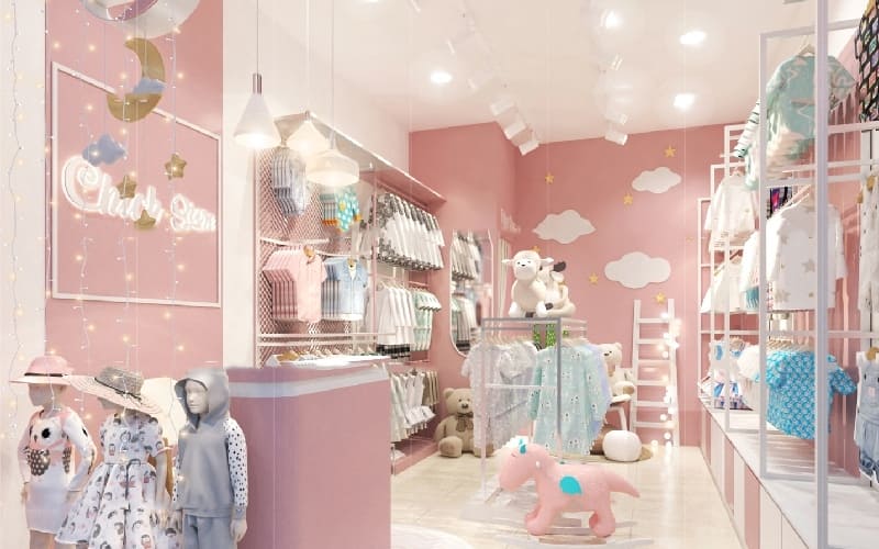 Mẫu thiết kế mang phong cách nhí nhảnh. Thiết kế shop quần áo cho trẻ với tông màu nổi bật như hồng, xanh dương, trắng,... tạo nên một không gian tươi sáng và như lạc vào thế giới trẻ thơ.